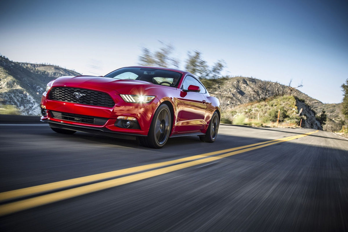 Red Mustang Speeding on Road