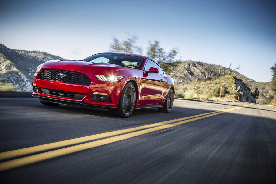 Red Mustang Speeding on Road