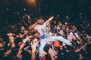 Energetic Rap Concert Crowd Surfing