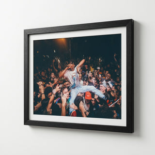 Energetic Rap Concert Crowd Surfing